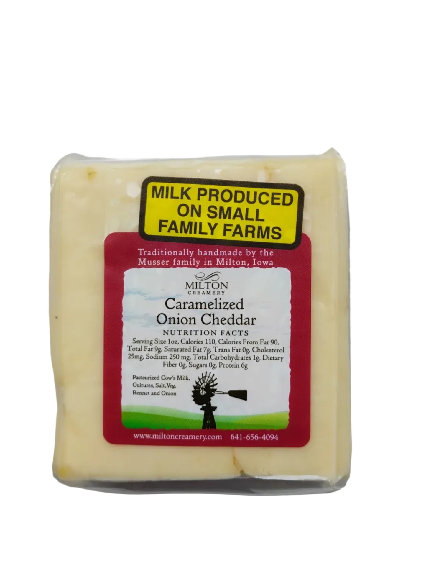 Block of cheddar cheese with a label on a white background