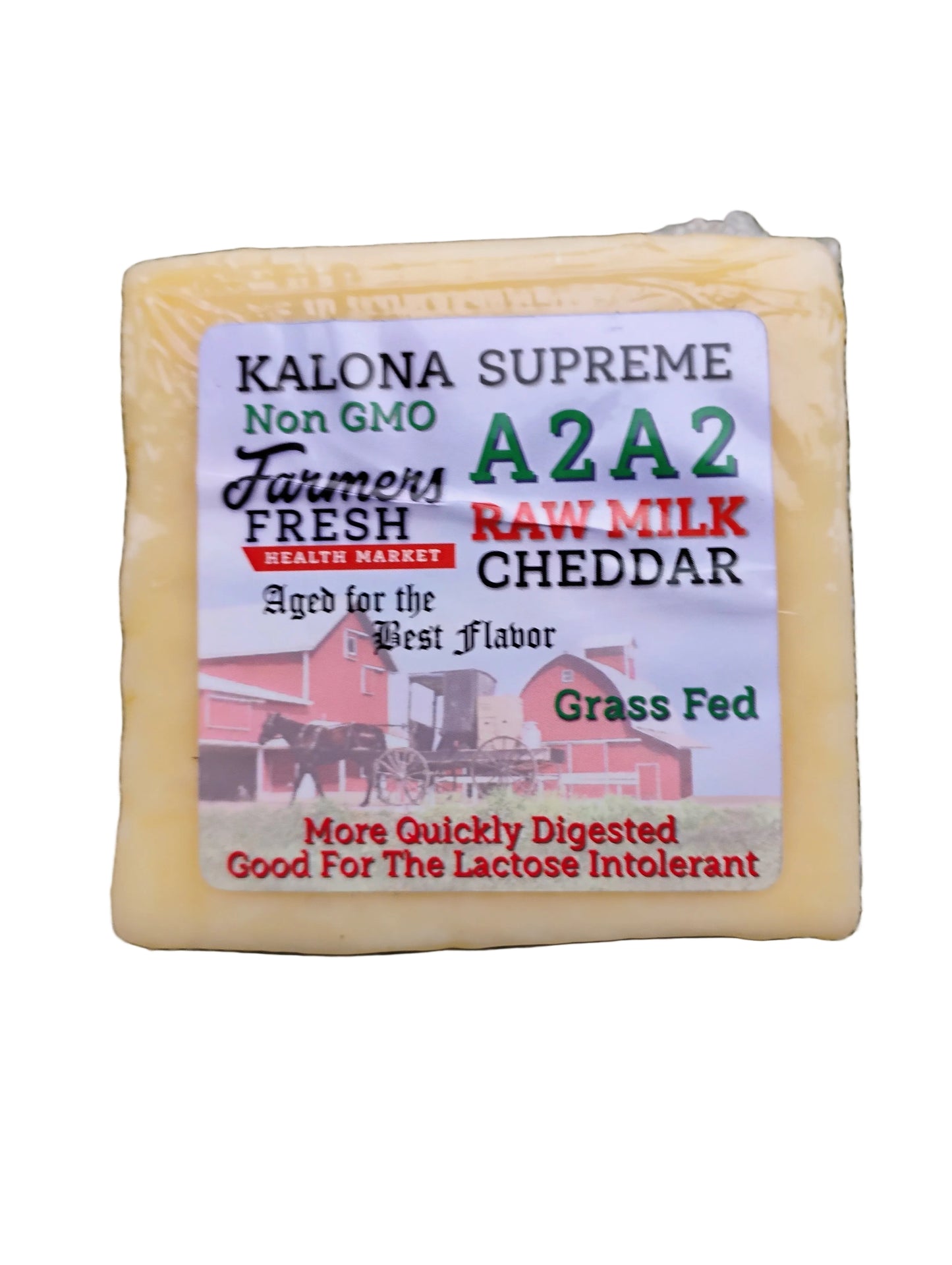 Block of Kalona Supreme A2A2 Cheddar cheese with a label on a white background.